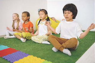 Young children practicing yoga